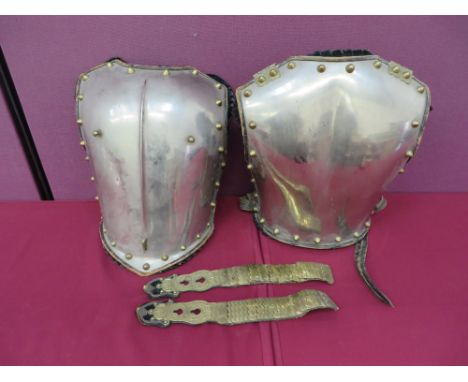plated breastplate with central raised rib.  Black leather covered edging and brass edge stud decoration.  Rear red leather b