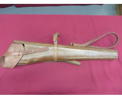 tan leather saddle bucket to accommodate a Madsen light machine gun.  35 inches long.  Top flap with securing strap and brass