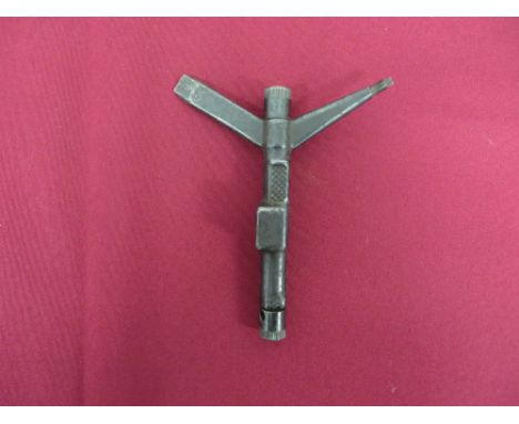 blued steel Y shape tool with screwdriver arm.  Removable top pricker.  Base with nipple key and removable screw tool.  Front