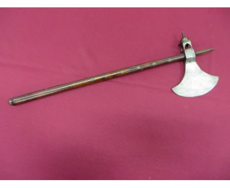 single edged crescent blade.  Central square form bracket with a rear temple shape chiselled mount.  Top square form spike.  