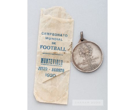 1930 FIFA World Cup silver plated participants medal,of circular form, obverse struck with a depiction of the centenary tower