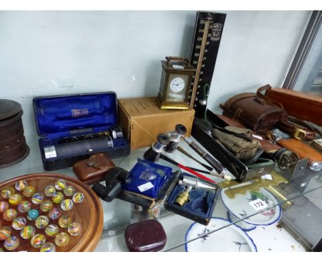 A COLLECTION OF OPTICAL INSTRUMENTS, A BLOOD PRESSURE INSTRUMENT, A CARRIAGE CLOCK AND A GLASS MARBLE SOLITAIRE SET