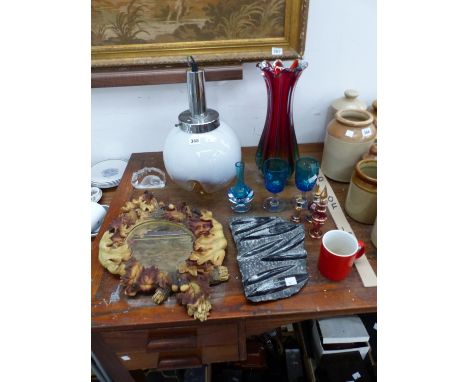 A SPERICAL WHITE GLASS TABLE LAMP, ART GLASS, A FOSSILIZED ROCK AND A RUSTIC MIRROR