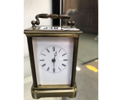 A FRENCH CARRIAGE CLOCK STRIKING THE HOURS ON A BELL