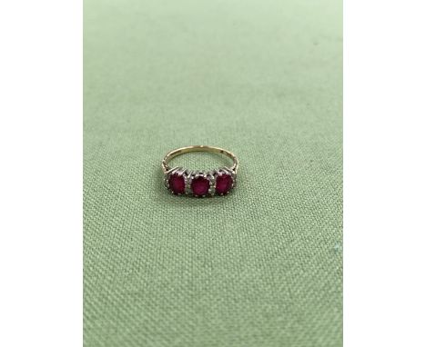 A 9ct GOLD HALLMARKED RUBY AND DIAMOND CLUSTER HALF HOOP RING. APPROX DIAMOND WEIGHT 0.15cts, WEIGHT 2.24grms. 