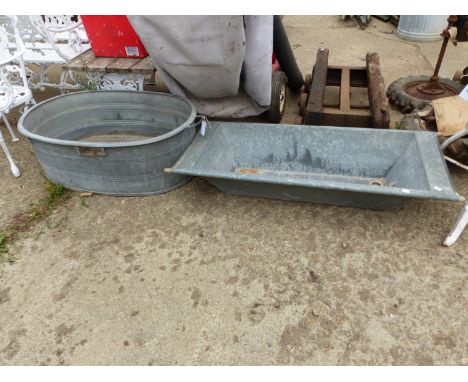 A LARGE GALVANIZED BASIN TOGETHER WITH A GALVANIZED TROUGH