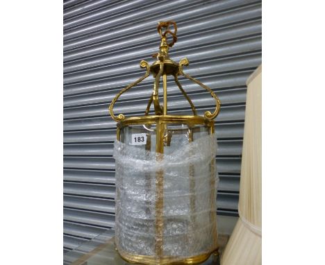 A GLAZED BRASS HALL LANTERN. H 58 W 25 cms