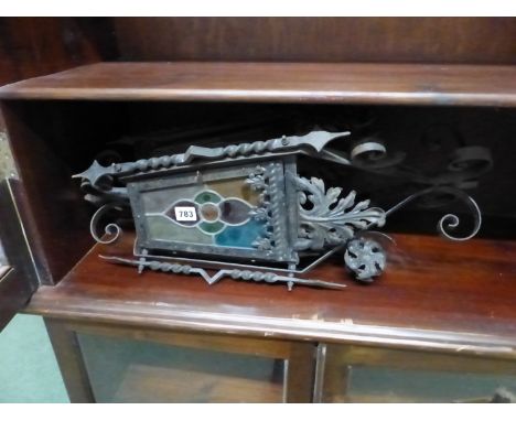 AN ANTIQUE WROUGHT IRON AND STAINED GLASS HALL LANTERN. 