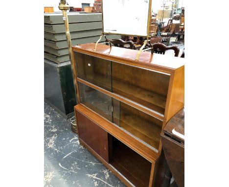 A MODERN MAHOGANY BOOK CASE, THE UPPER HALF WITH SLIDING GLASS DOORS OVER TWO SHELVES, THE BASE WITH PANELLED DOORS.   W 90 x
