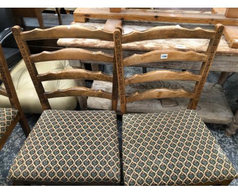 A PINE REFECTORY TABLE TOGETHER WITH FOUR LADDER BACK DINING CHAIRS