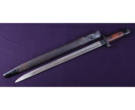 A British 1907 pattern bayonet, the 43cm single edged fullered blade marked to the ricasso '10 '15 Sanderson with various Ord