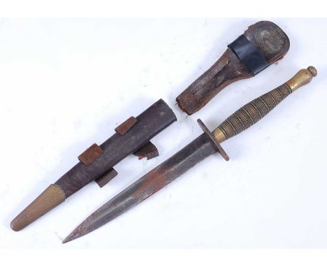 A Fairbairn Sykes 2nd Pattern Commando Knife, having a 17cm stiletto type double edged blade with oval crossguard, beaded and
