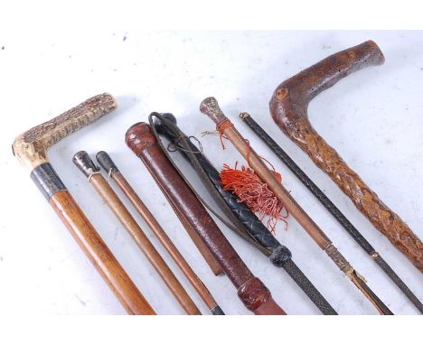 An early 20th century riding crop, having a malacca shaft with silver plated collar, the stag antler handle with Swaine &amp;