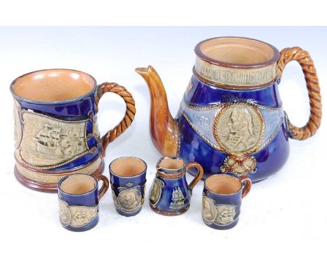A Royal Doulton Nelson commemorative mug, circa 1905, on a mottled blue ground relief decorated with a portrait plaque of Nel