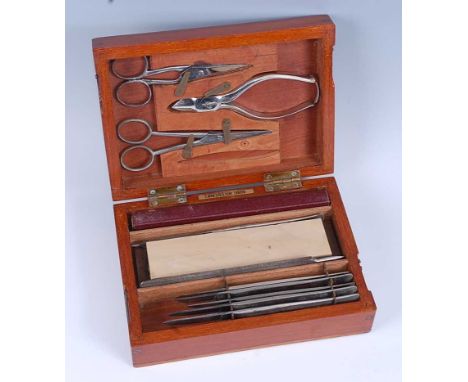 A military field surgeons kit, the mahogany case of plain rectangular form with inset brass plaque to the lid with War Depart
