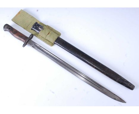 A British 1907 pattern bayonet, the 43cm single edged fullered blade marked to the ricasso with a crowned GR cypher Wilkinson