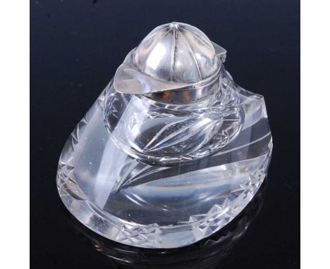 An early 20th century German novelty inkwell, the clear cut glass body in the form of a horse hoof, the hinged silver cover i