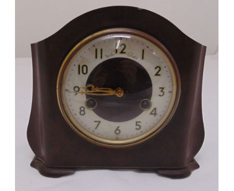 An original 1930 Bakelite chiming mantle clock with Roman numerals on shaped pad feet, 19cm (h) 20cm (w)