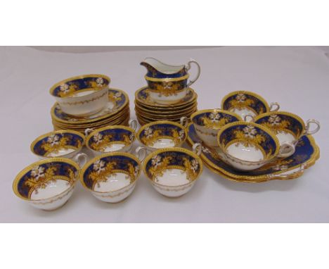 An Aynsley tea set to include plates cups and saucers and a cream jug (36)