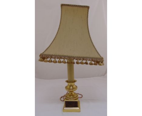 A gilded metal and onyx lamp stand on square plinth to include shade , 74cm (h)