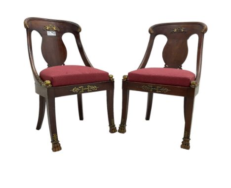 Pair of French Empire mahogany spoon0back side chairs, reeded cresting rail with scrolled ends over a shaped and pierced back