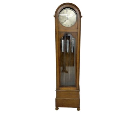 German - 1930s 8-day chiming longcase clock in an oak case, with a break arch top and fully glazed door, plinth raised on bun