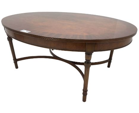 Mahogany oval coffee table (115cm x 86cm, H49cm); and matching circular lamp table (D61cm, H49cm)