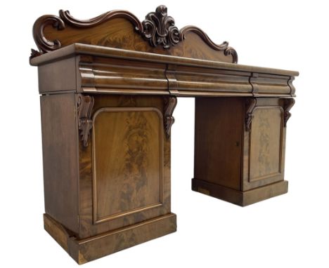 Victorian mahogany twin pedestal chiffonier, raised back with decorated with scrolling foliate motifs, fitted with three cush