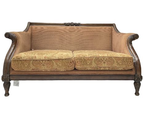 Victorian design mahogany two-seat sofa, the cresting rail carved with foliage scrolls, curved and sweeping arms with acanthu