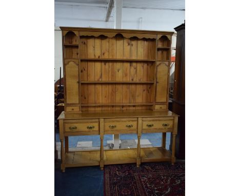 A Crossbanded Light Oak Three Drawer Dresser with Pot Shelf on Turned Supports and Having Raised Three Shelf Plate Rack with 