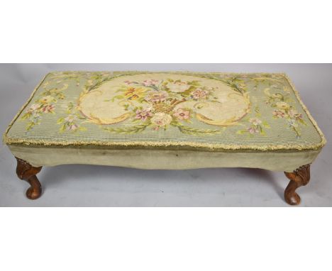 A Rectangular Tapestry Upholstered Footstool on Short Cabriole Supports, 96cm wide 