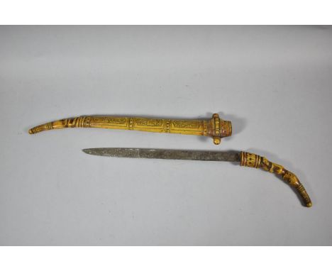 A Souvenir African Tribal Dagger with Carved Figural Handle, Inscribed Blade and Carved Wooden Scabbard Decorated with Lizard