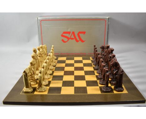 A Novelty Sherlock Holmes Chess Set, The Kings 13cm high, On 50cm Square Inlaid Wooden Chess Board 