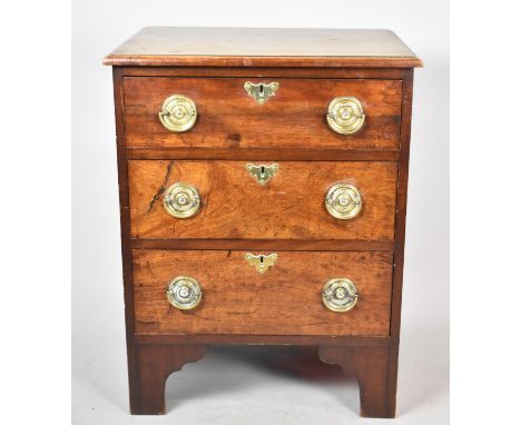 A 19th Century Mahogany Chest of Small Proportions Having Three Drawers with Brass Circular Drop Handles and Escutcheons, Bra