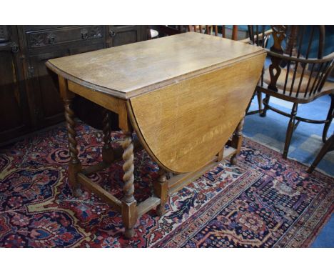 An Edwardian Oak Barley Twist Gate Legged Dining Table, 104cm wide 