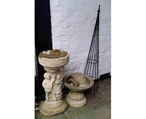 A small reconstituted stone campana shaped bird bath, another larger with figural putti plinth (used for succulents) and a me