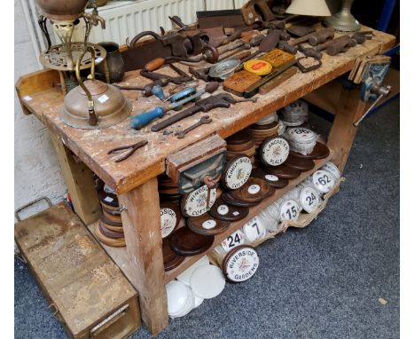 A workshop work bench fitted with vices 