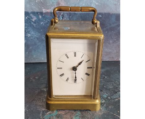 An early 20th century brass carriage clock, Roman numerals, swing handle, 11cm high, c.1910 