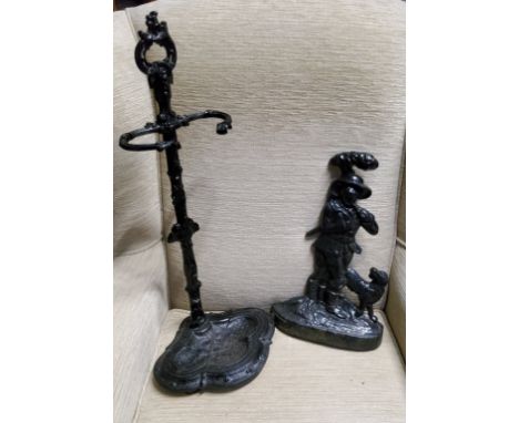 A Victorian style cast iron stick stand, 64cm high;&nbsp; an iron door stop, cast with forester and his dog, 38cm high (2) 