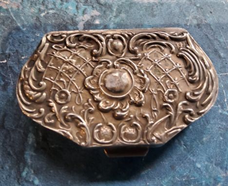 A continental silver coloured metal cartouche shaped snuff box, the cover embossed with scrolls and trellis, 5.5cm wide 