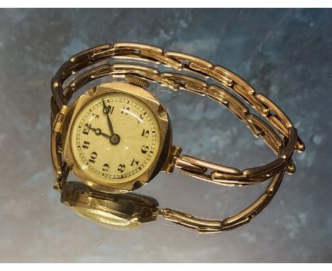 A 9ct gold lady's watch, Swiss 15 jewel movement cream engine turned dial, Arabic numerals, 9ct gold expanding bracelet, c.19