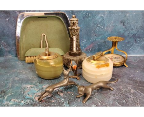 A serpentine light house thermometer;&nbsp; two onyx table lighters;&nbsp; a Etainfin pewter stylised cat;&nbsp; a similar de