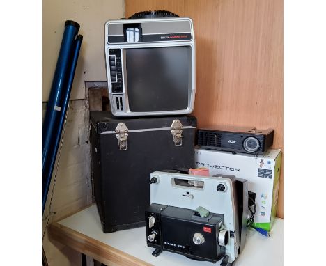 An Elmo SP-F slide projector;&nbsp; a Telex Caramate 4000 Sound/Slide projector, model 4344;&nbsp; a screen (3) 