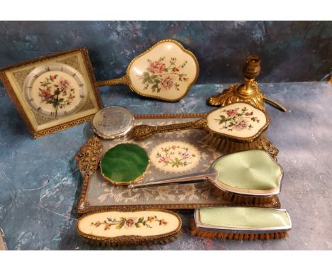 A Regent of London gilt metal and embroidered dressing table set, comprising easel clock, dressing table tray, mirror, hair a
