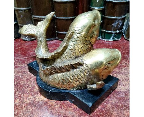 An unusual bronze desk weight, Pisces, cast with two gilt bronze fish, shaped marble base, 18cm wide 