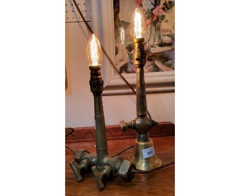 A novelty side light, formed from a brass beer tap, 24cm high;&nbsp; another (2) 