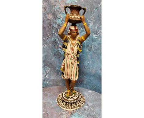 A 20th century cold painted bronze figure, of a Nubian, carrying an urn on his head, 36.5cm high 