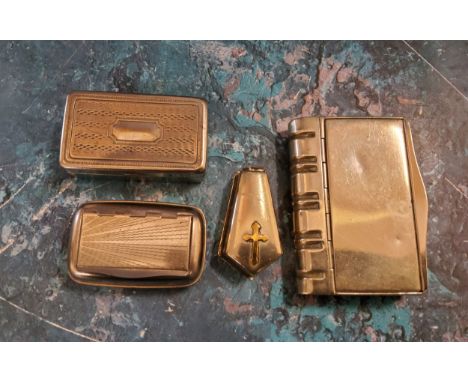 An early 20th century plated snuff box, in the form of a book, 8.5cm wide, c.1910;&nbsp; another, as a coffin, 5cm long;&nbsp