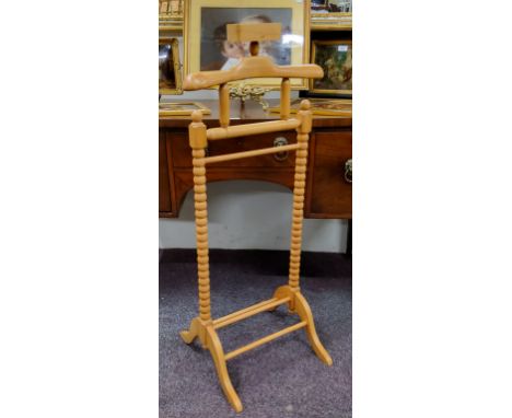 A contemporary bobbin turned valet stand 
