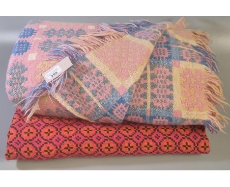 Pink ground Welsh woollen tapestry traditional Caernarfon design fringed edge blanket, together with vintage woolen Welsh tap
